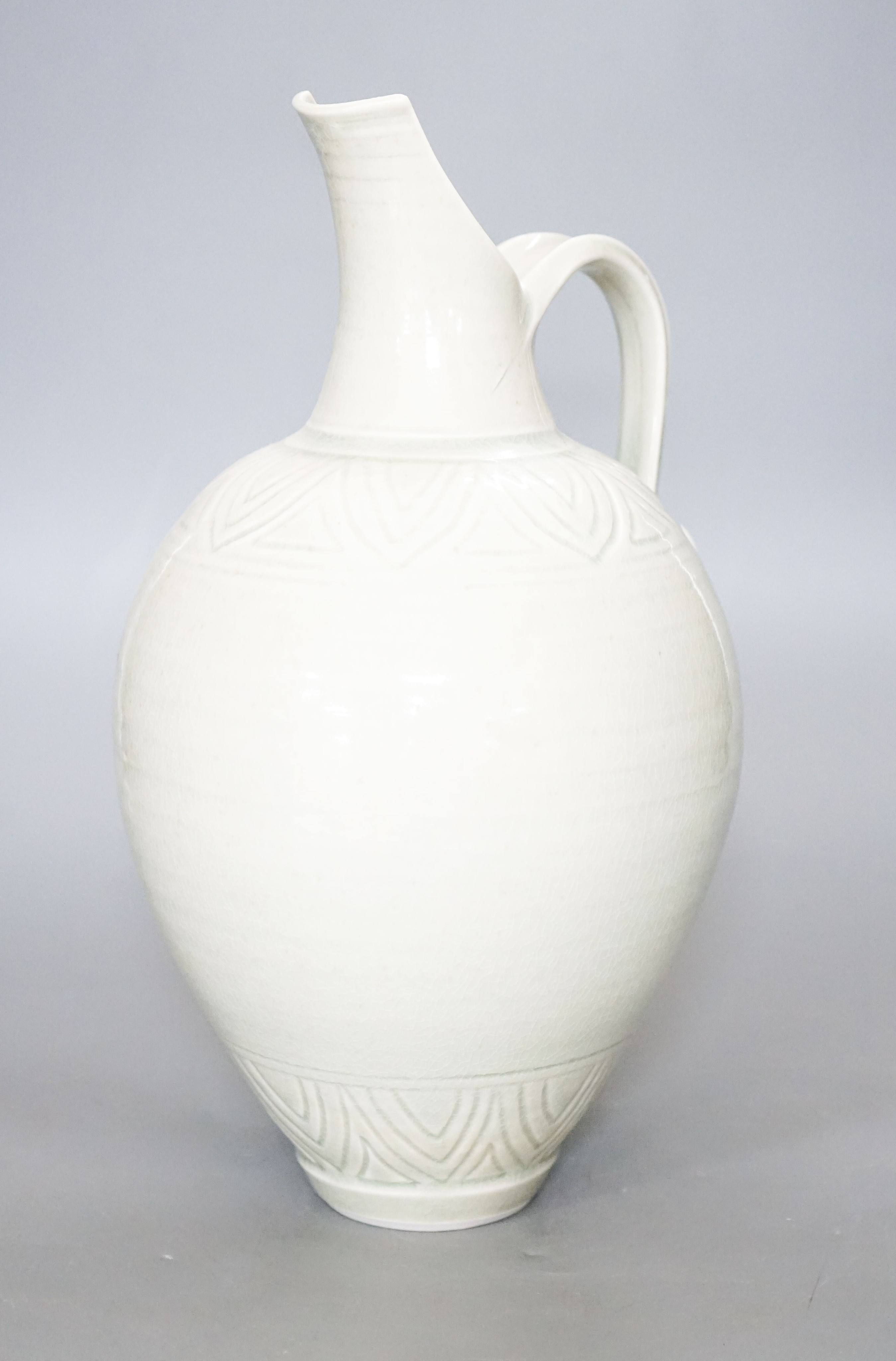 Bridget Drakeford (b.1946), a celadon glazed porcelain jug 30cm